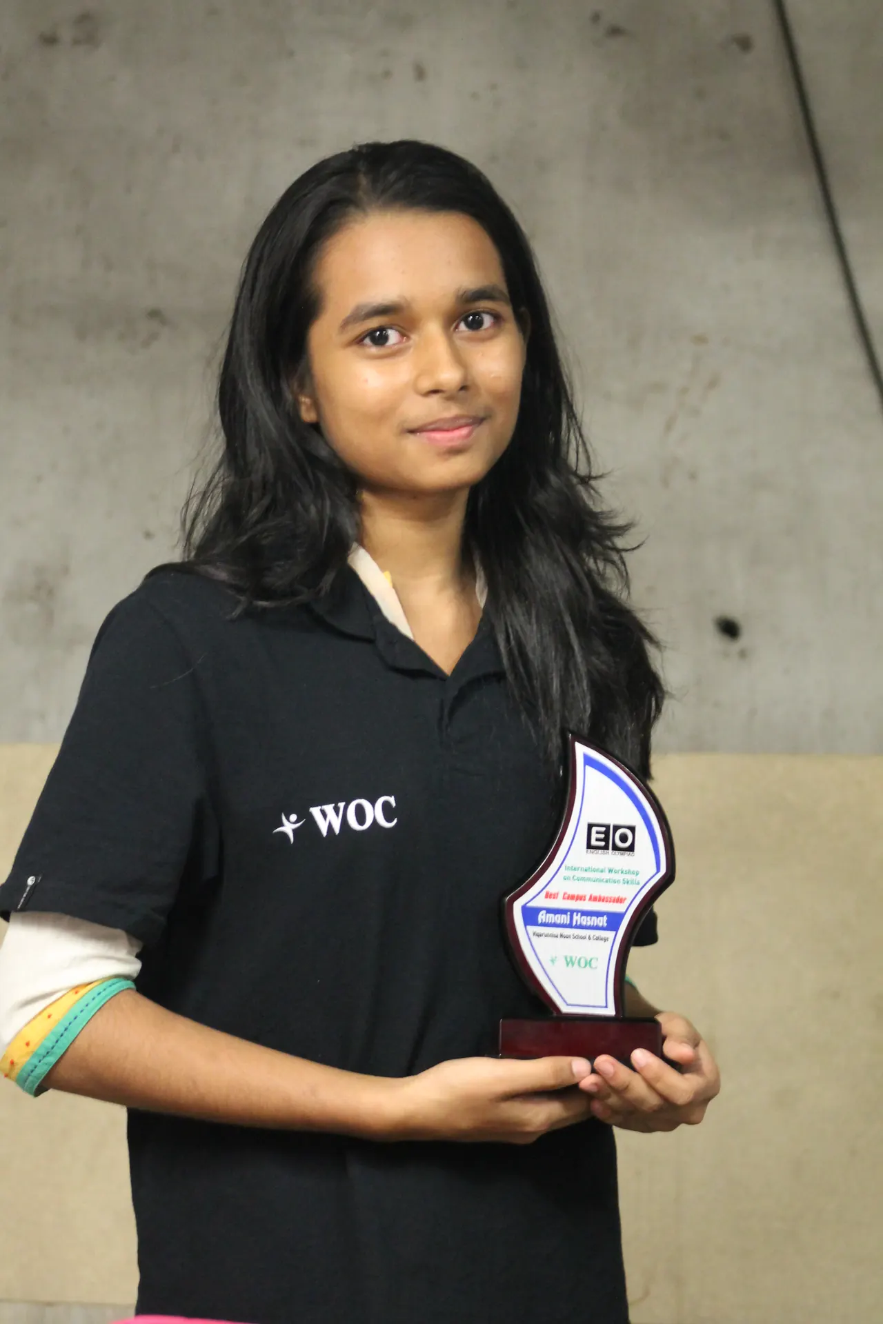 Winner holding the English Olympiad crest